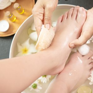 foot washing in spa before treatment. spa treatment and product